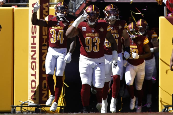 Washington Commanders defensive tackle Jonathan Allen (93) leads teammates out of the tunnel onto the field prior to their game against the Tennessee Titans at FedExField.